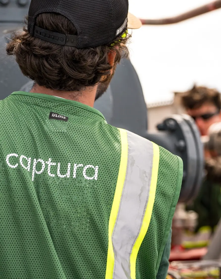 Team member wearing a Captura vest